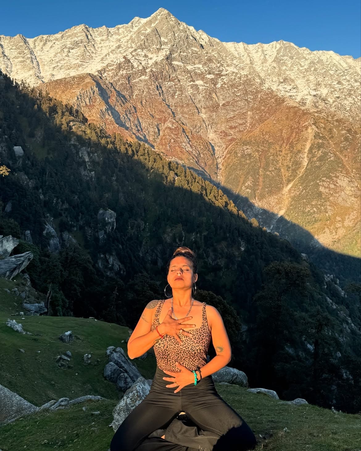 Calm woman meditating in natural light
